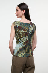 Back view of sleeveless printed top with green, gold, and brown butterfly pattern