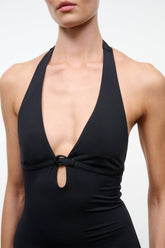 Black halter one-piece swimsuit with deep V neckline and front ring detail