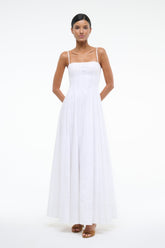 White maxi dress with square neckline and spaghetti straps, fitted bodice and flared skirt