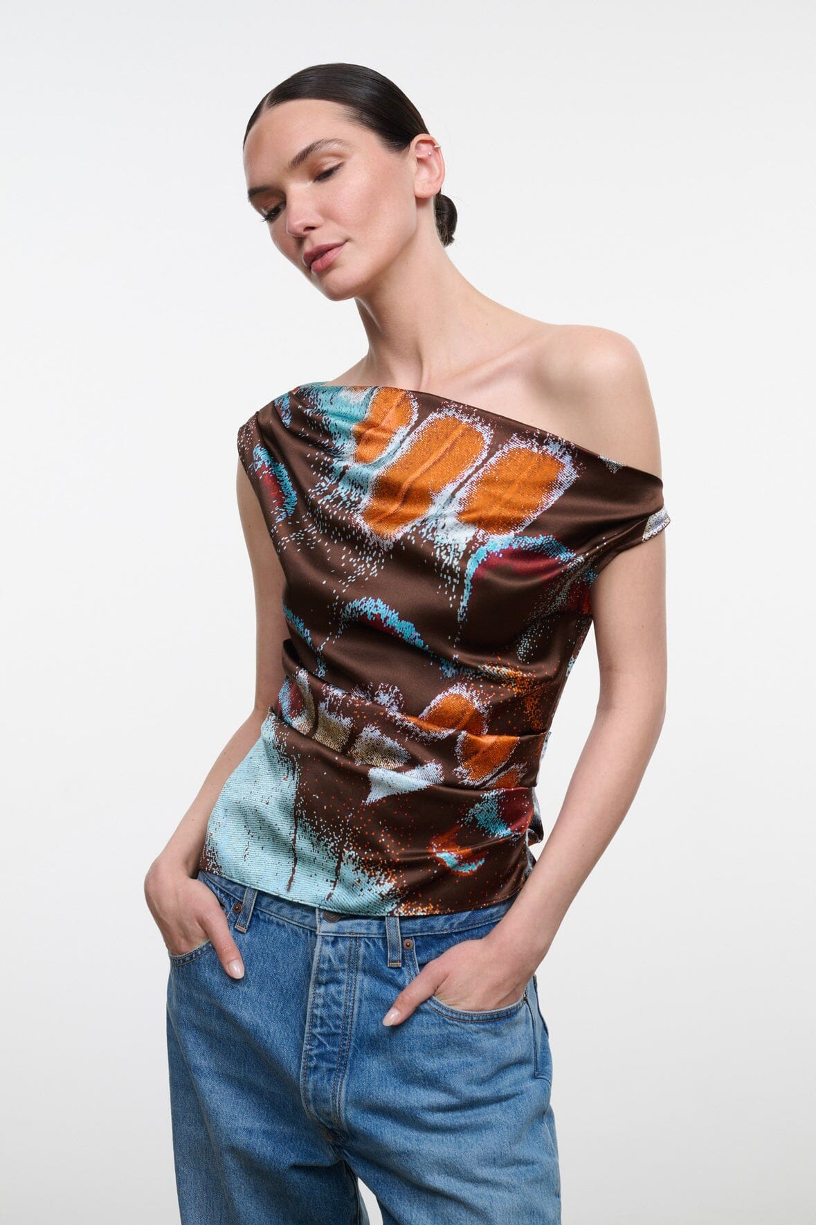 Silk one-shoulder top with draped cowl neckline, brown orange turquoise butterfly print