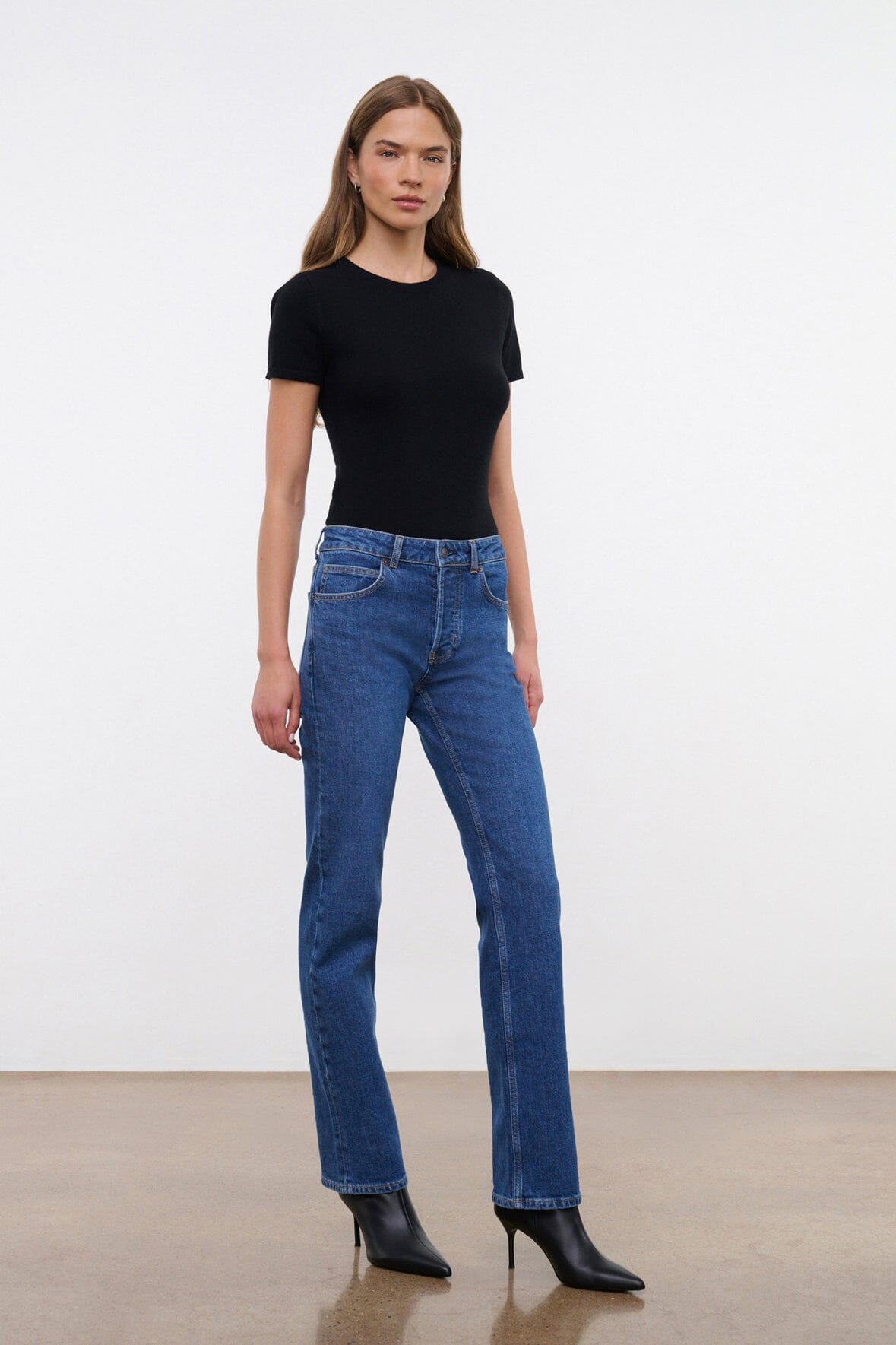 Stone blue straight stretch jeans on model, full length, straight leg