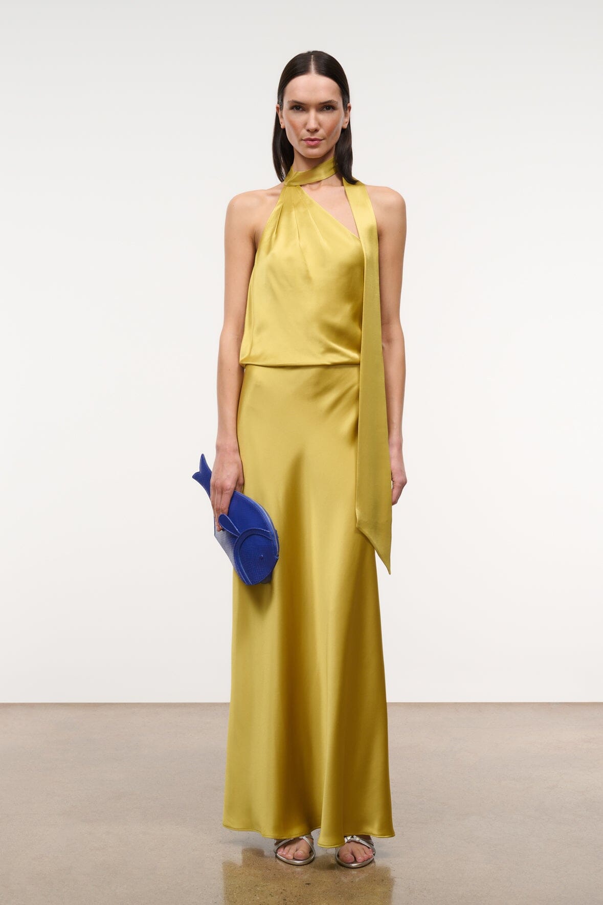 Citron yellow satin halter maxi dress with draped bodice and open-back detail