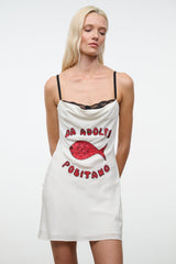 White mini dress with black lace-trimmed straps and red fish graphic on front