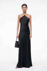 Black halter maxi dress with draped halter neckline and chain straps