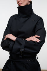 Black high-neck jacket with snap buttons, wide cuffs, and belted waist strap