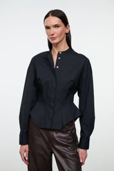 Black long-sleeve top with stand collar, button placket, shaped peplum hem