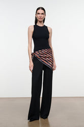 Cecile silk scarf with black base and orange-red abstract stripes, draped on model
