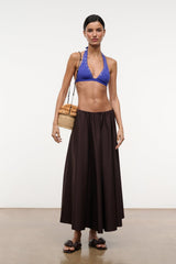 Dark brown maxi skirt with gathered waist and pleated full skirt, side view