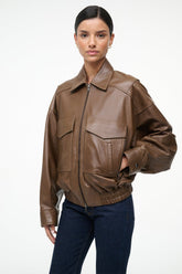 Brown leather bomber jacket with stand collar, zip front, and side snap pockets