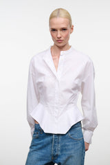 White collared button-up top with long sleeves, front placket, flared hem