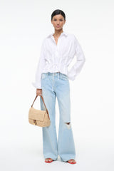 White PRIMROSE shirt with tied front waist, long sleeves, and pointed collar