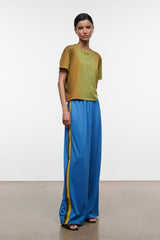 Blue wide-leg pants with elastic waistband and yellow side stripe