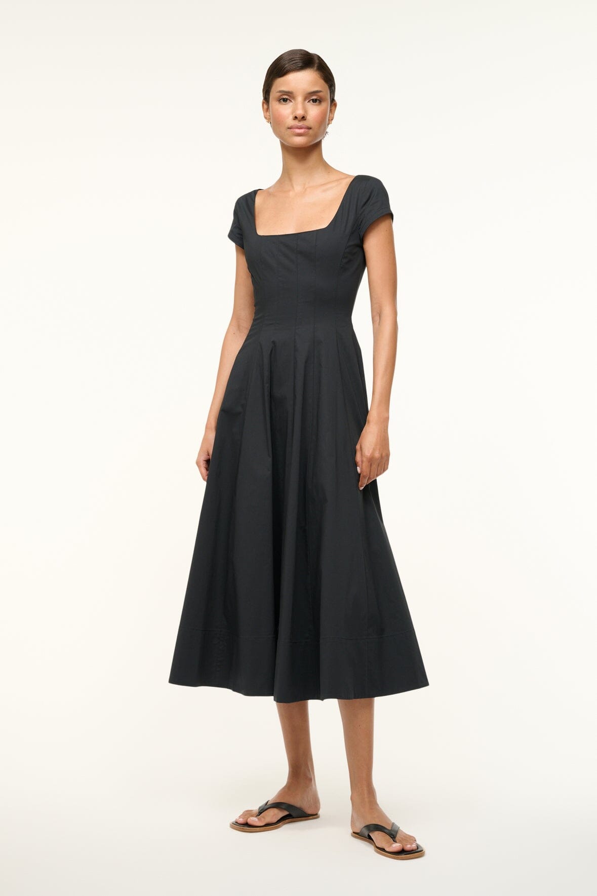Black short-sleeve midi dress, square neckline, cinched waist, pleated full skirt