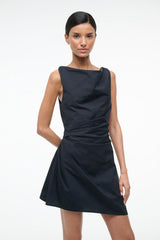 Black sleeveless mini dress with draped crossover neckline and flared skirt