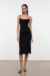 Black draped midi dress with spaghetti straps and cowl neckline