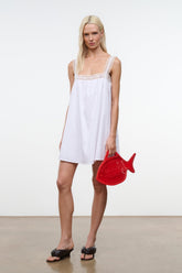White sleeveless mini dress with lace-trim straps and gathered skirt