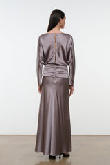 Back view of zinc satin silk dress with long sleeves, ruched waist, and full skirt