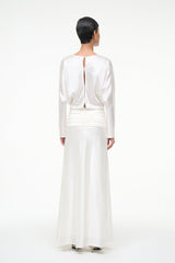 Ivory silk midi dress with open back and ruched hip detail, rear view