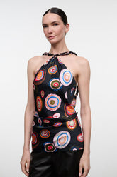 Silk halter top with multicolor circular print on black, sleeveless keyhole
