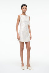 Ivory sleeveless mini dress with textured leaf print, side view.
