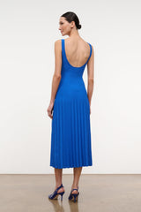Cobalt blue sleeveless midi dress with open back and pleated knit skirt