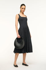 Black crescent hobo bag held by the top handle