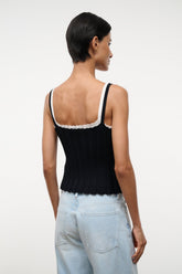 Black sleeveless tank top with white lace-trimmed scoop back