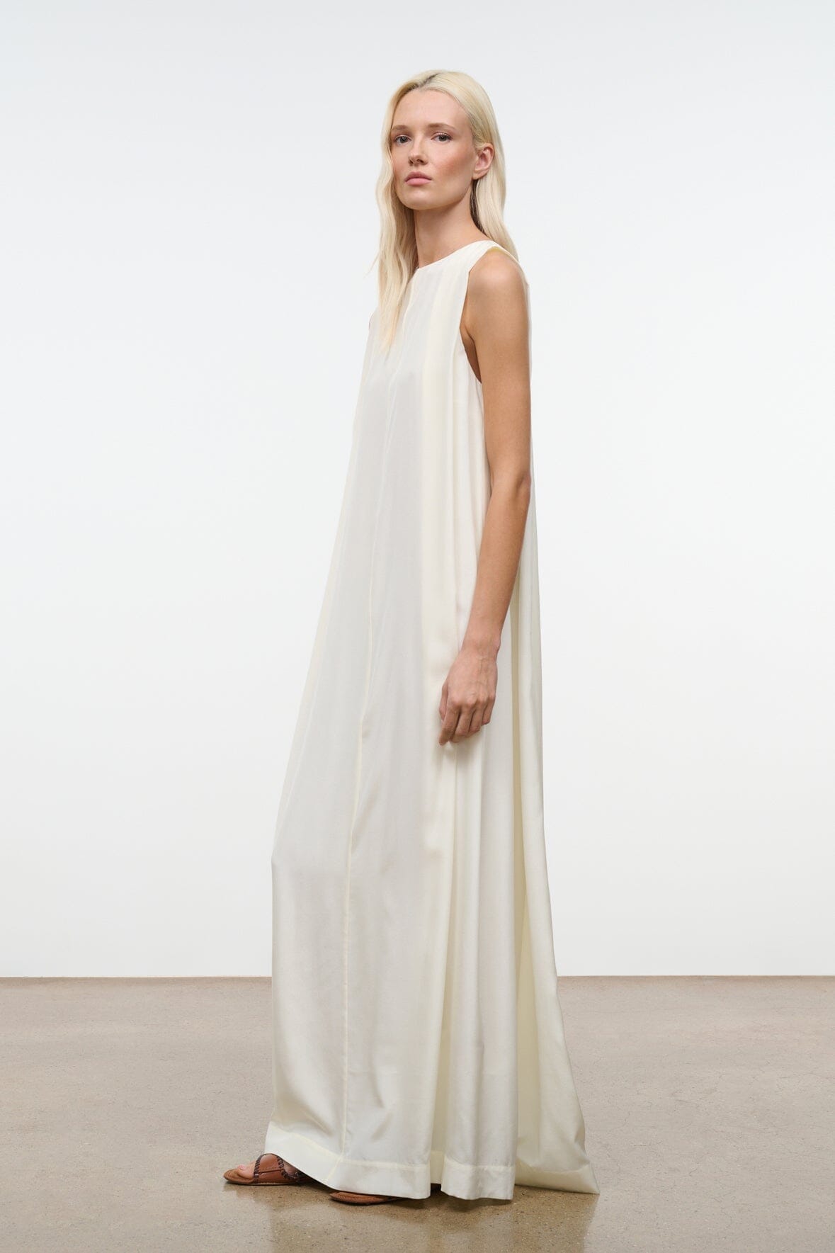 Ivory silk maxi dress, sleeveless scoop neckline and flowing skirt