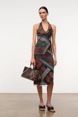 Sleeveless beaded V-neck top with dark floral pattern, sheer layers and beaded trim