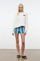Blue vertical striped shorts with orange and beige stripes, elastic waistband