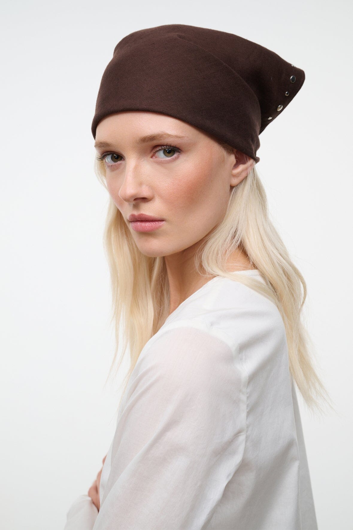 Brown headscarf with side stud accents, fitted wrap style