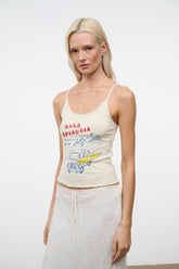 Cream sleeveless graphic camisole top with scoop neckline and thin straps