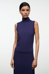 Sleeveless navy turtleneck knit top with ribbed hem and fitted waist