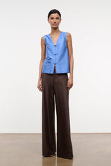 Light blue silk dupioni sleeveless top with V-neck and vertical placket