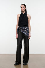 Black leather trousers with wide legs, front pockets, and subtle stitched paneling