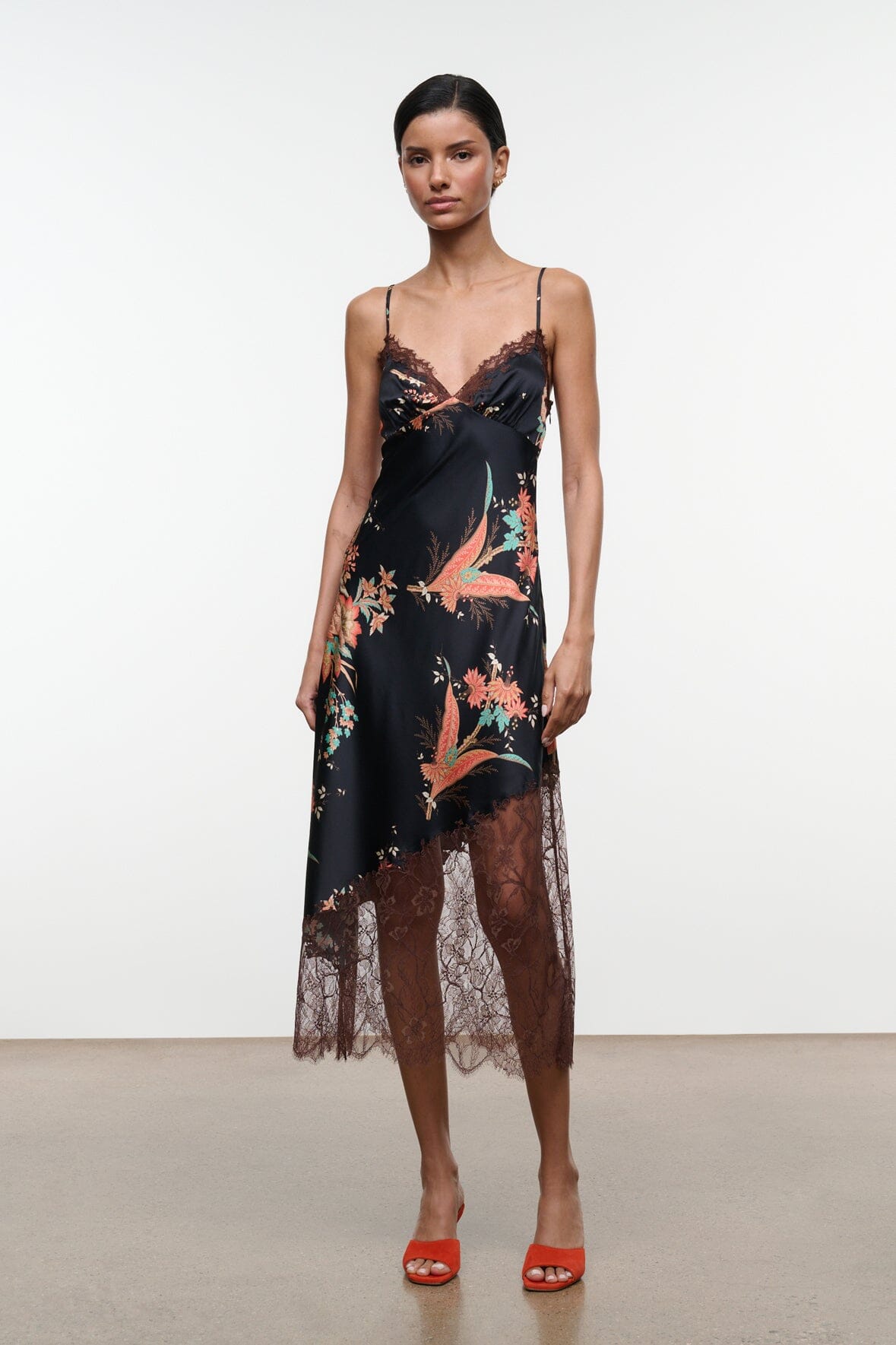 Black silk dress with floral tapestry print, lace-trim hem, thin spaghetti straps, midi