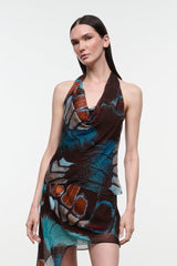Printed sleeveless halter top with crossover drape front in blue and brown
