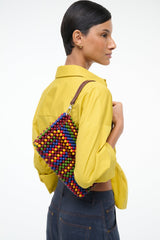 Multicolor beaded shoulder bag back view with brown strap and beaded rim