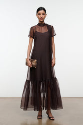 Earth-brown maxi dress with sheer yoke and tiered tulle hem