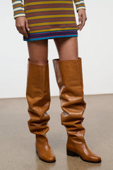Cashew brown over-the-knee boots, smooth toe and ruched shaft with black heel