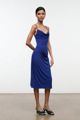 Midnight blue midi dress with cowl neckline and thin straps, side drape