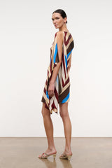 Sleeveless silk dress with asymmetrical drape hem in striped brown, cream, burgundy, blue