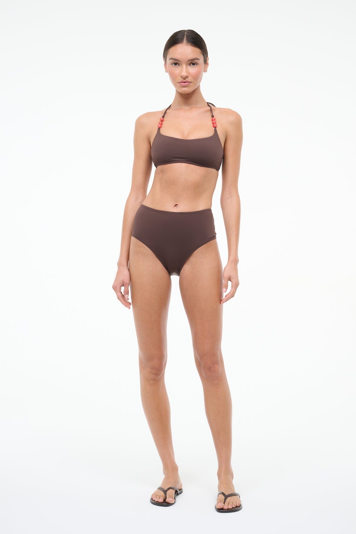 High-rise dark brown bikini bottom on model, minimal seam finish