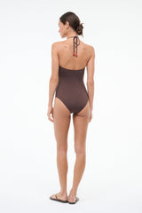 Back view of dark brown halter one-piece with tie-back and red beaded accents
