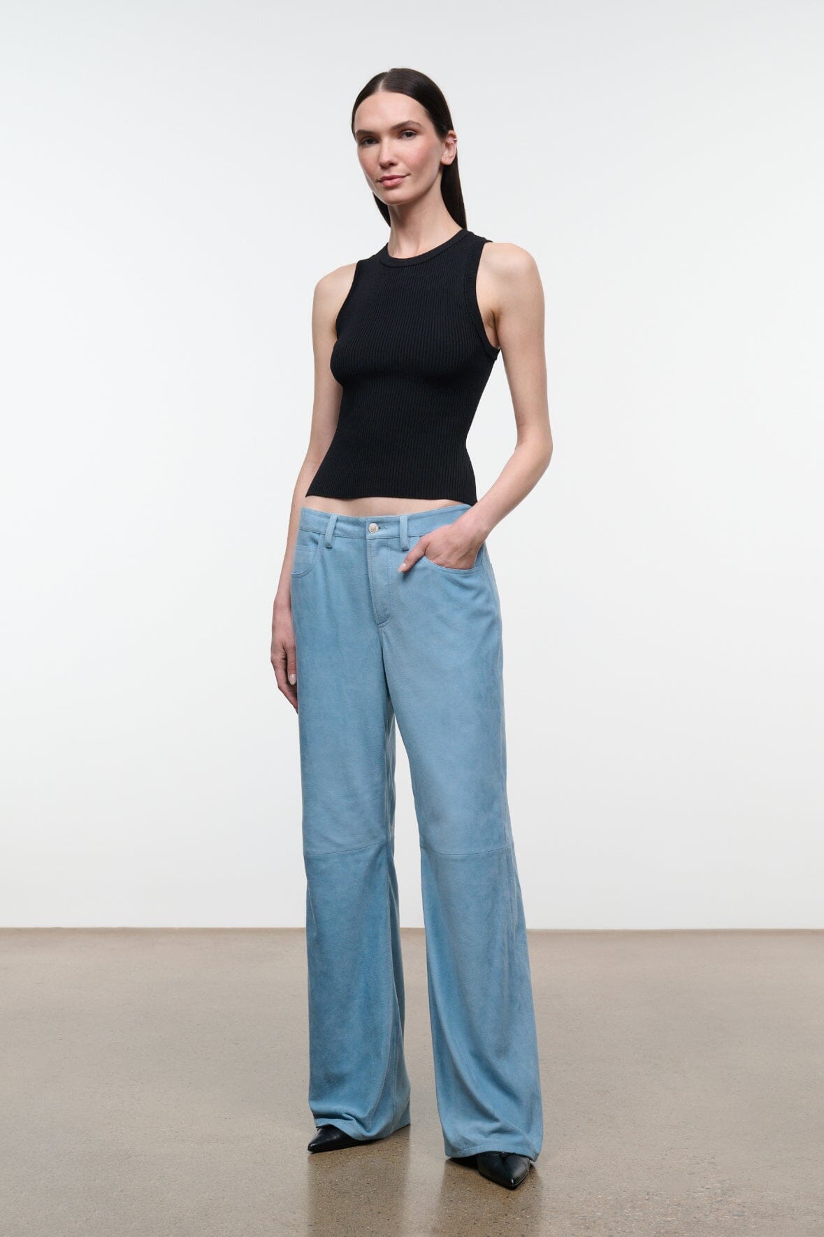 Sky blue suede wide-leg pants with button fly, belt loops, and side pockets.