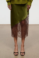 Espresso snake-print mule with open toe, slim heel, and braided bow detail