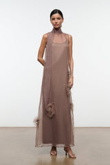 Taupe sleeveless maxi dress with feather applique trim along skirt