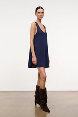 Sleeveless navy A-line dress with U neckline and navy trim at armholes