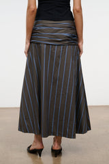 SOL striped midi skirt with vertical blue and tan stripes on dark fabric, A-line hem