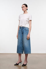 Light blue denim culotte jeans with mid-rise waist and stitched front pockets